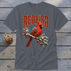 A dark gray t-shirt with a graphic of a red cardinal on a snowy branch beneath the text "REDBIRD".