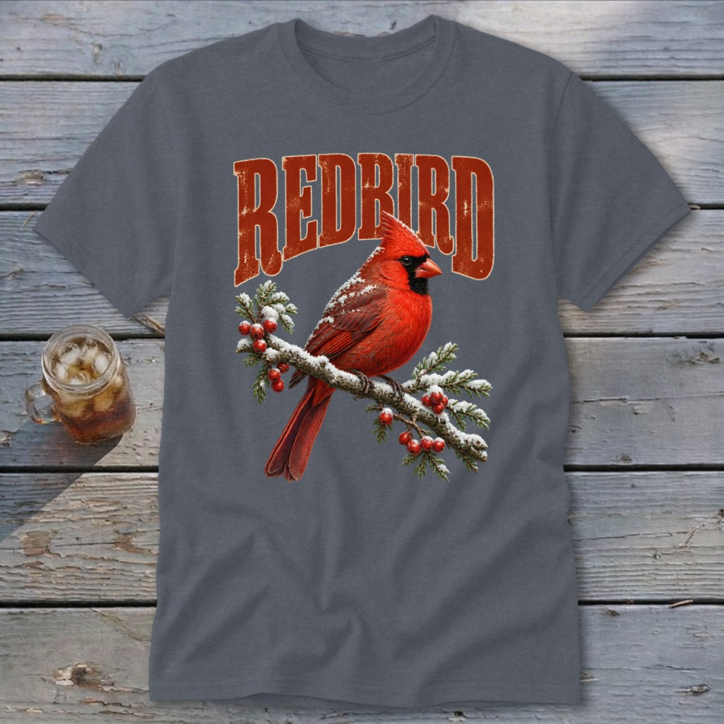 A dark gray t-shirt with a graphic of a red cardinal on a snowy branch beneath the text "REDBIRD".