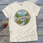 Cream t-shirt with circular vintage Pennsylvania landscape graphic featuring deer.