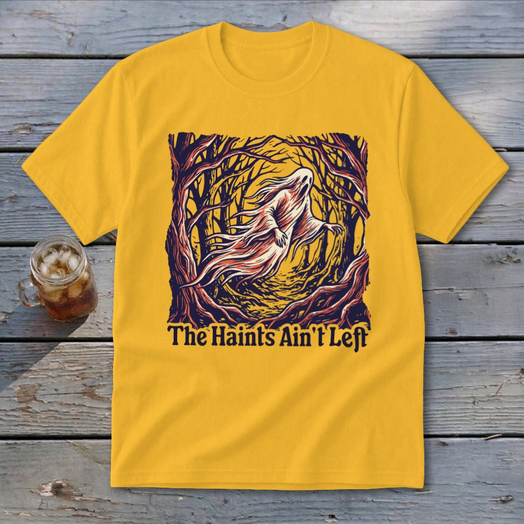 Yellow t-shirt with ghost in a dark forest graphic and text "The Haints Ain't Left".
