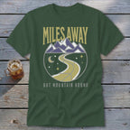 Green t-shirt with "Miles Away" text and mountain landscape graphic.