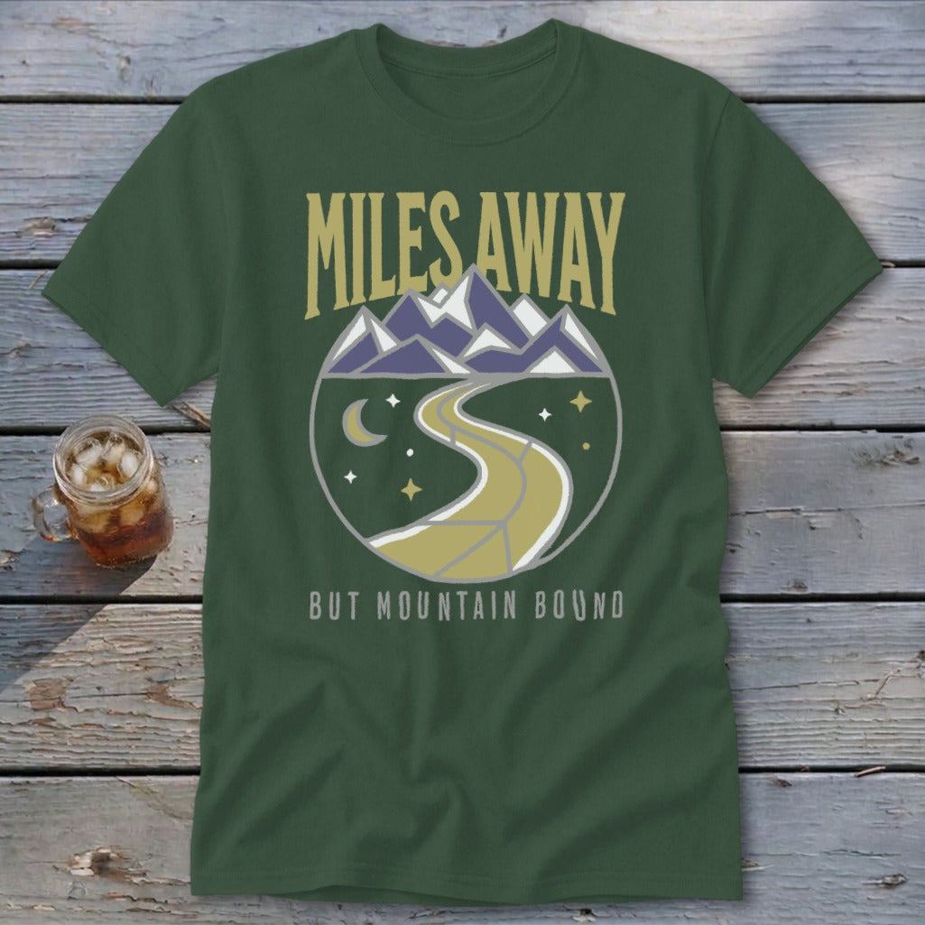Green t-shirt with "Miles Away" text and mountain landscape graphic.