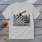 White t-shirt with woodpile, axe, and text "Stacked For The Season" graphic.