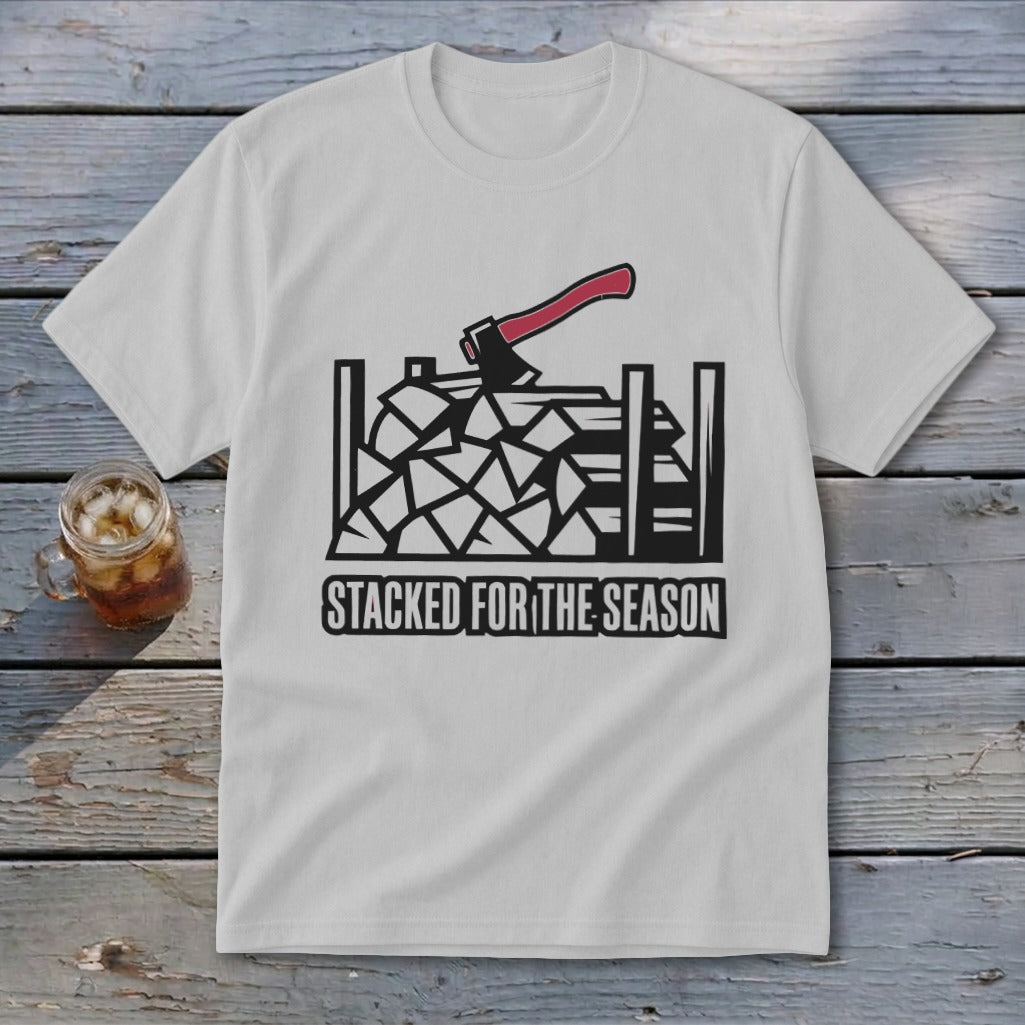 White t-shirt with woodpile, axe, and text "Stacked For The Season" graphic.