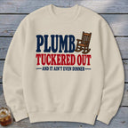 Cream sweatshirt with "Plumb Tucker Out" and a rocking chair graphic.