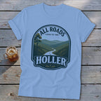 Light blue t-shirt with "All Roads Lead to the Holler" landscape graphic.