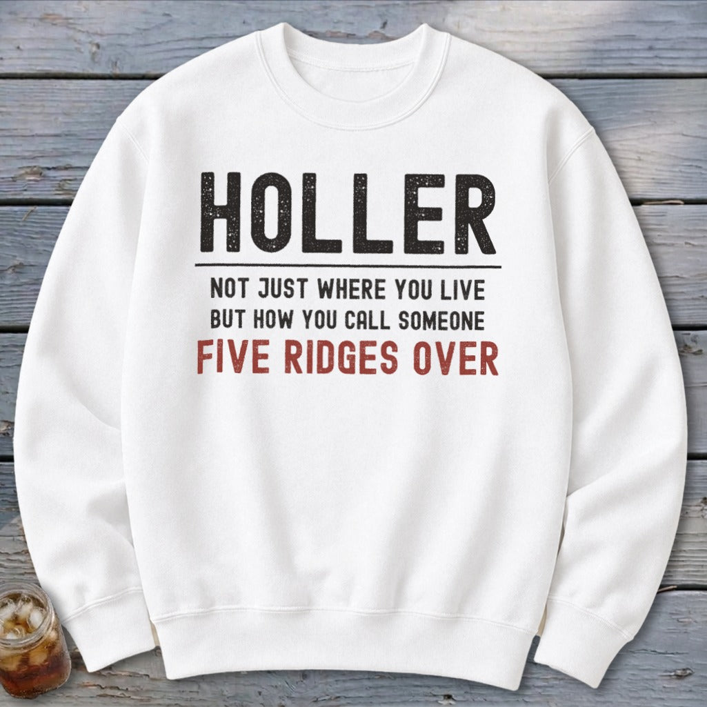 White sweatshirt with text "HOLLER" and "FIVE RIDGES OVER" in red.
