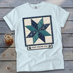Light blue t-shirt with an eight-pointed star quilt block design.