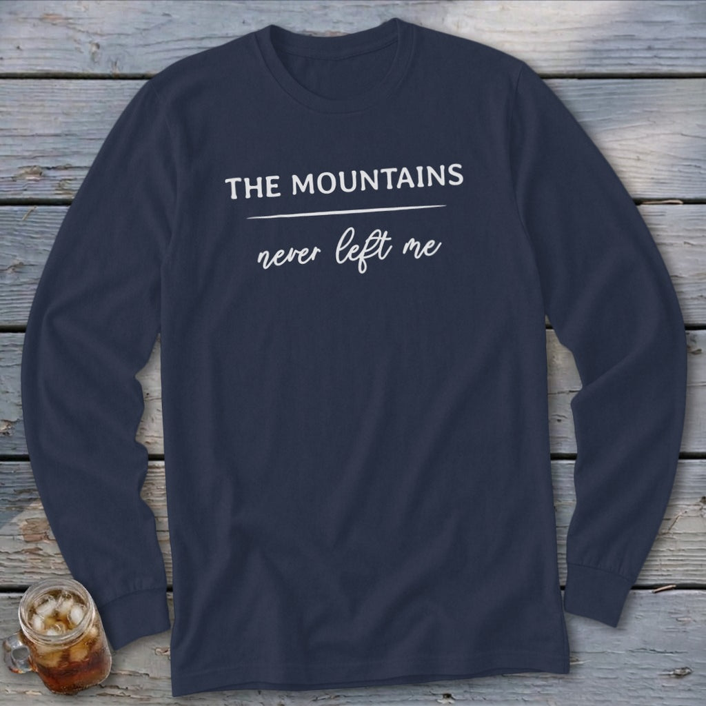 Navy long-sleeve shirt with white text: "THE MOUNTAINS never left me".