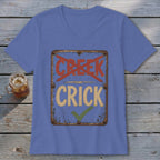 T-shirt with "CREEK" crossed out and "CRICK" with a checkmark on a sign.