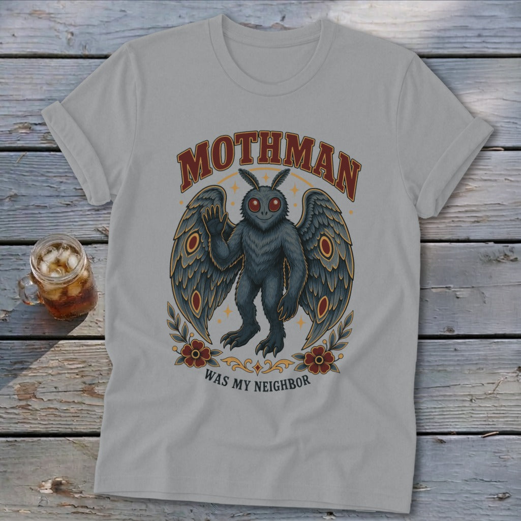 Light grey t-shirt with Mothman graphic and text "MOTHMAN WAS MY NEIGHBOR".