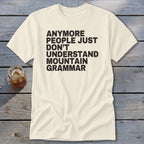 Cream t-shirt with black text "anymore people just don't understand mountain grammar."