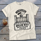 A cream-colored t-shirt with a black graphic of a porch, a Wi-Fi symbol, and the text "HOLLER WIFI? One bar, if you stand on the porch".