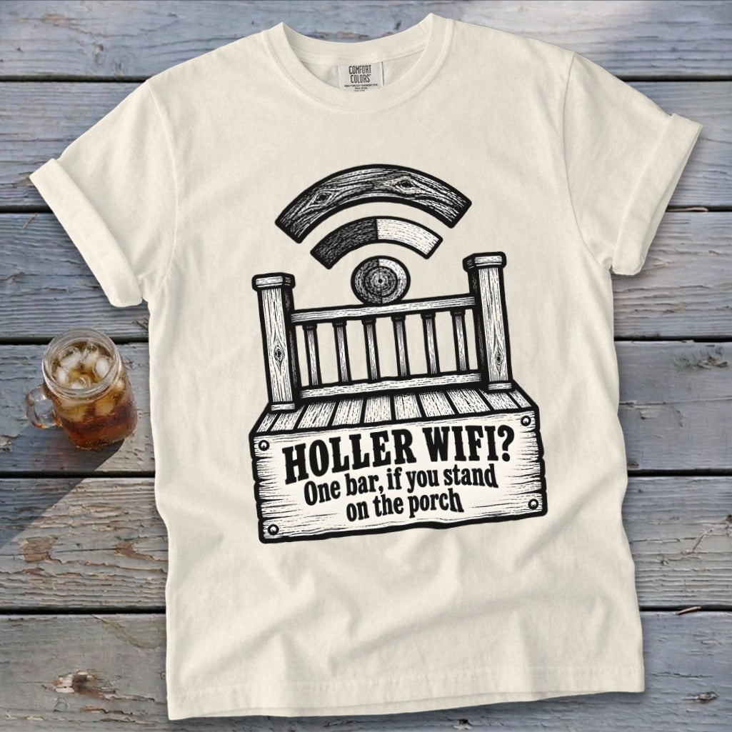 A cream-colored t-shirt with a black graphic of a porch, a Wi-Fi symbol, and the text "HOLLER WIFI? One bar, if you stand on the porch".