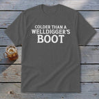 Dark grey t-shirt with white text "Colder Than A Welldigger's Boot".