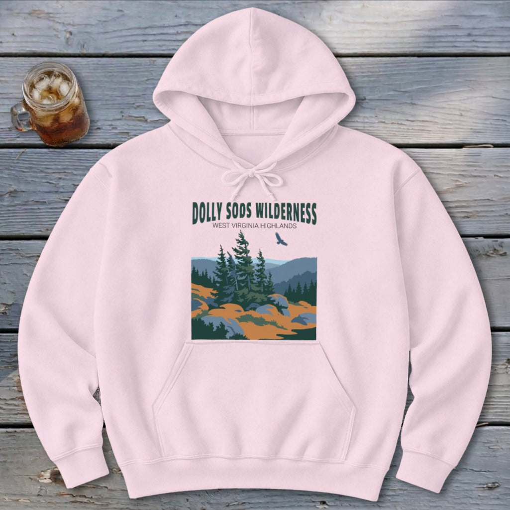 A light pink pullover hoodie featuring a graphic print of Dolly Sods Wilderness with evergreen trees and mountains.