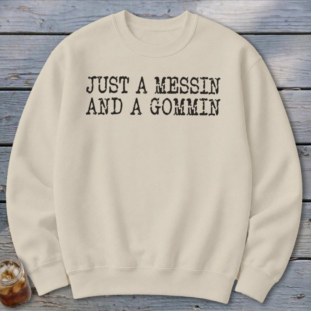 Cream sweatshirt with black text reading "JUST A MESSIN AND A GOMMIN".
