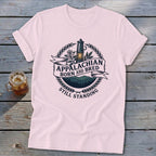 Light pink t-shirt with Appalachian Born and Bred Still Standing graphic.
