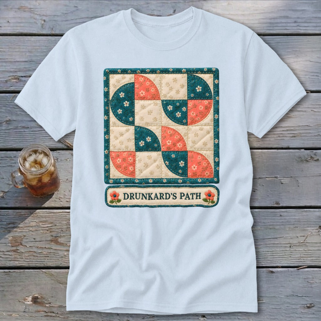Light blue t-shirt with Drunkard's Path quilt pattern and text.