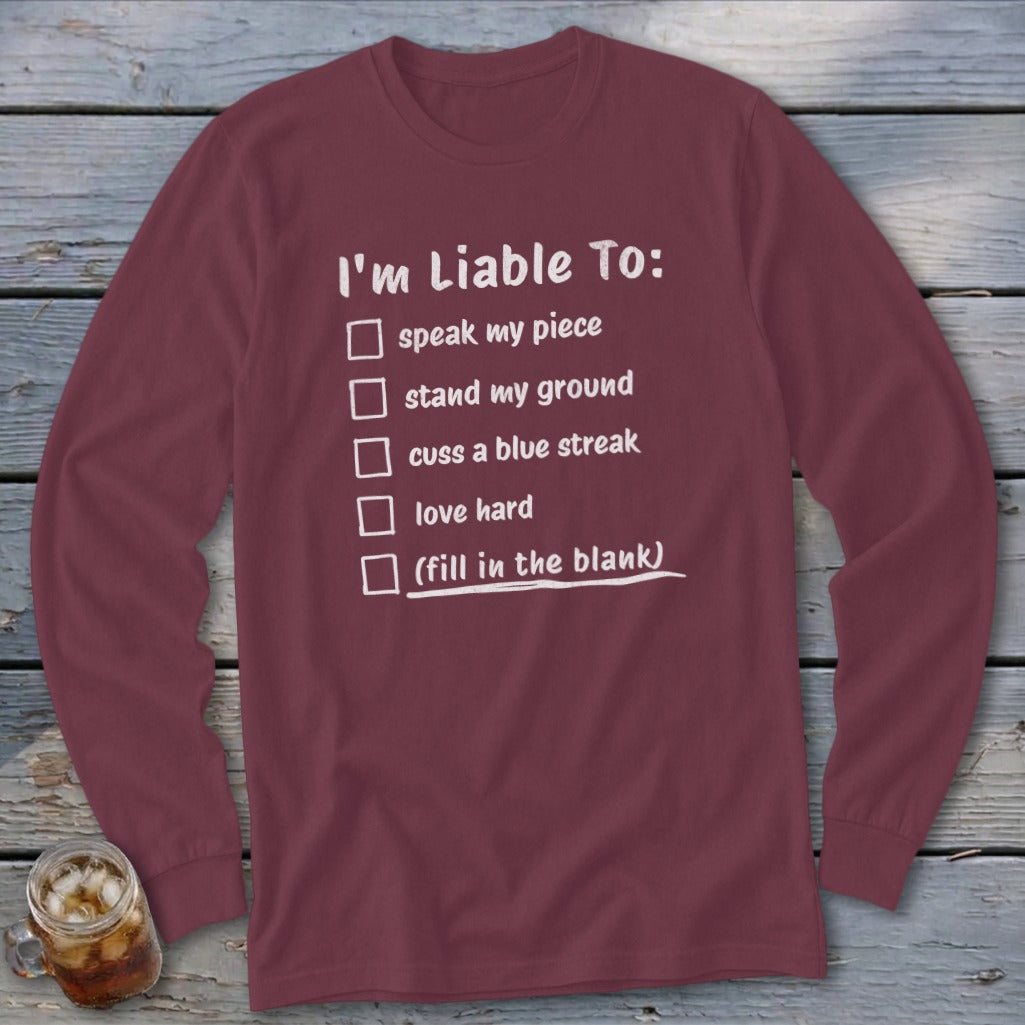 Maroon long sleeve shirt with white text "I'm Liable To:" followed by a checklist.