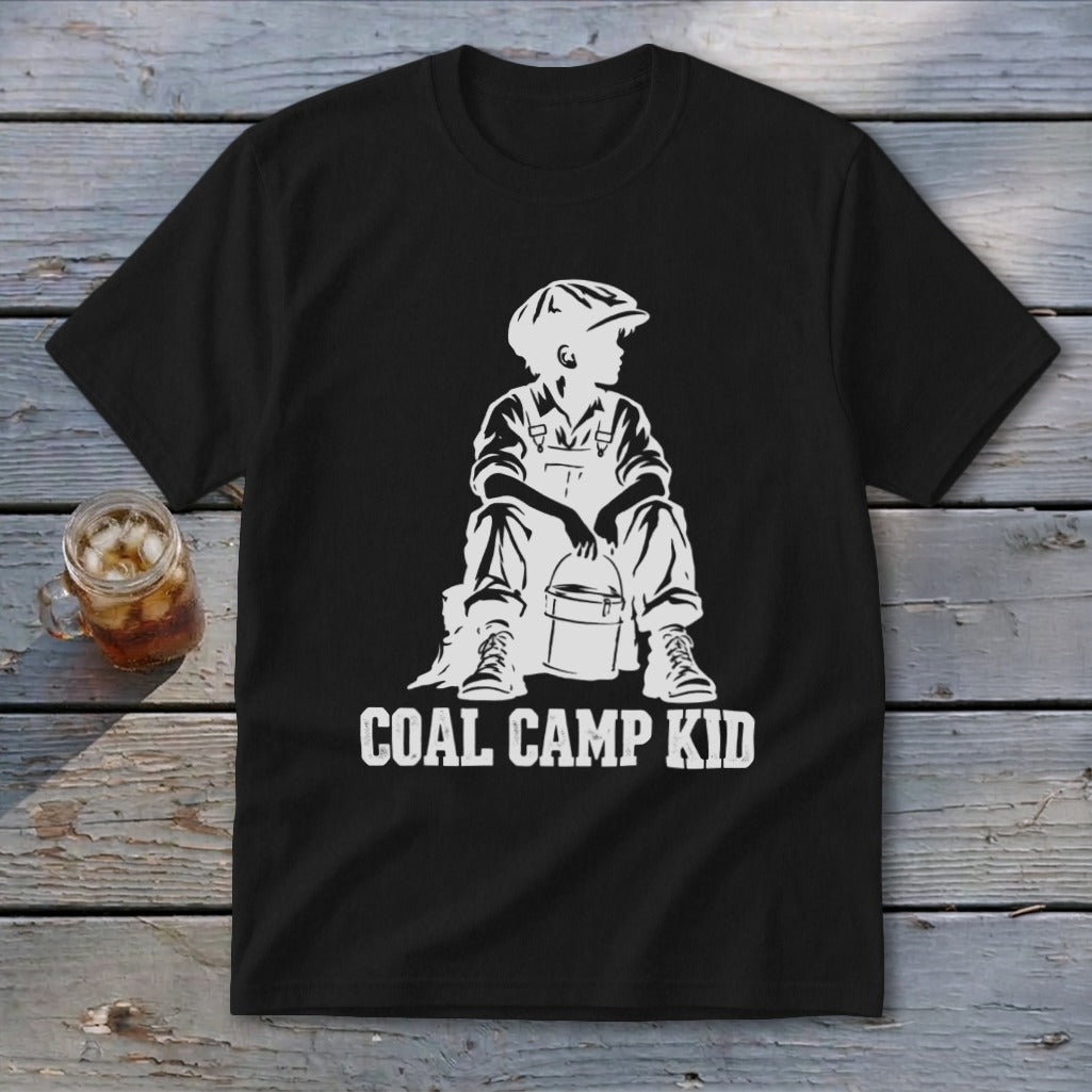 Black t-shirt with white graphic of a boy in overalls and cap sitting with a bucket, text "COAL CAMP KID".