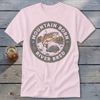 Pink t-shirt with circular graphic of jumping trout, mountains, and text "Mountain Born River Bred".