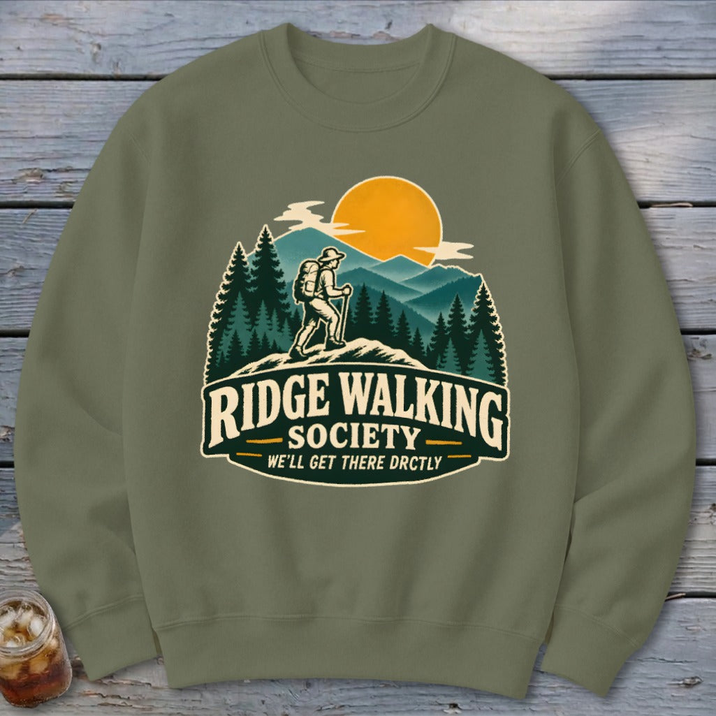 Olive sweatshirt with "Ridge Walking Society" graphic featuring a hiker and mountains.