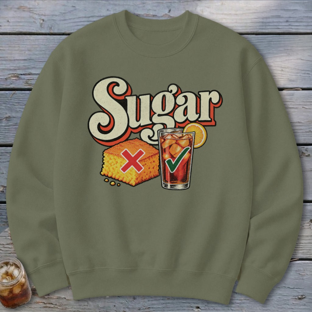 Olive green crewneck sweatshirt featuring a graphic of cornbread with a red X and iced tea with a green checkmark below the text Sugar.