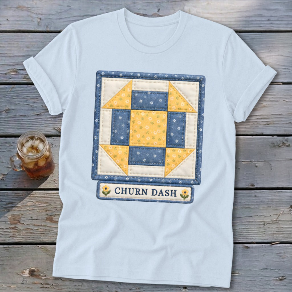 Light blue t-shirt with a Churn Dash quilt block design and text.
