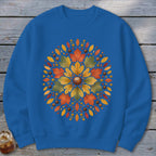 Blue sweatshirt with a circular autumn leaf and acorn design.