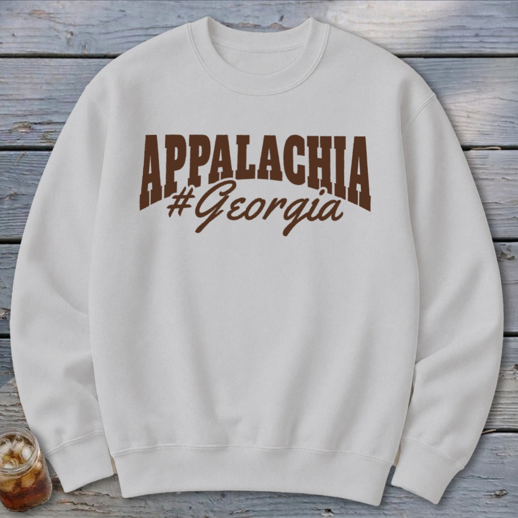 White sweatshirt with "APPALACHIA #Georgia" printed in brown.