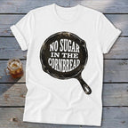 White t-shirt with a cast iron skillet graphic that reads "No Sugar in the Cornbread".