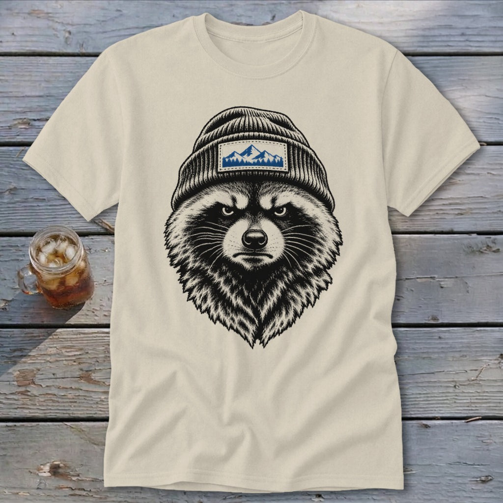T-shirt with black and white illustration of a raccoon wearing a beanie with mountain patch.