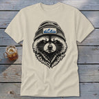 T-shirt with black and white illustration of a raccoon wearing a beanie with mountain patch.