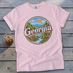 Pink t-shirt with circular Georgia landscape graphic featuring a deer and a river.