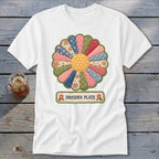 White t-shirt with colorful Dresden Plate flower graphic and text.