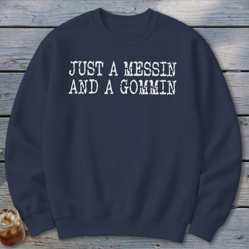 Navy sweatshirt with white text reading "JUST A MESSIN AND A GOMMIN".