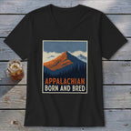 Black V-neck t-shirt featuring a retro graphic of mountains, pine trees, and the text APPALACHIAN BORN AND BRED.