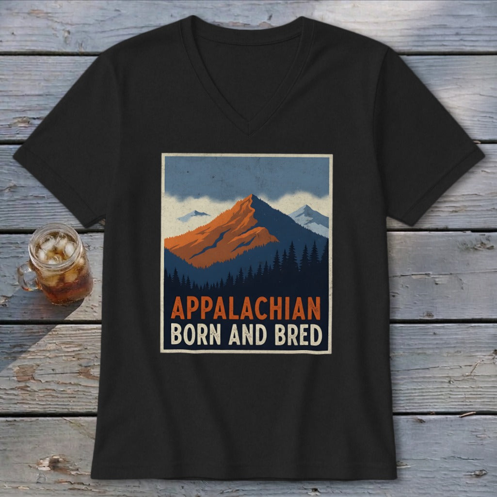 Black V-neck t-shirt featuring a retro graphic of mountains, pine trees, and the text APPALACHIAN BORN AND BRED.