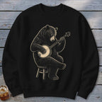 Black sweatshirt with illustration of a bear playing a banjo while sitting on a stool.