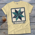 Light yellow t-shirt with an eight-pointed star quilt block graphic.