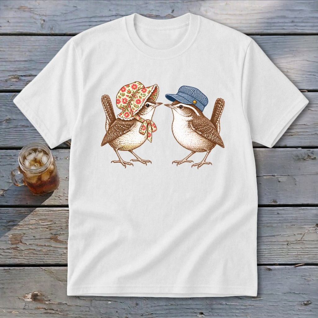 White t-shirt with a graphic of two wrens wearing hats and scarves.