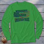 A green long-sleeved t-shirt features text and an American flag graphic on the chest.