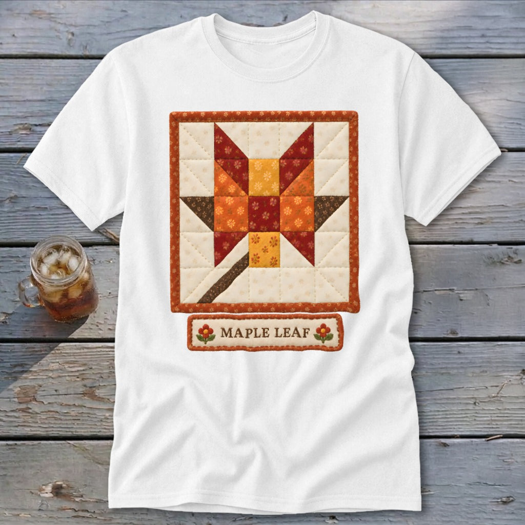 White t-shirt featuring a quilted maple leaf design and "Maple Leaf" text.