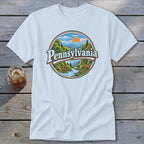 White t-shirt with circular graphic of Pennsylvania landscape and deer.