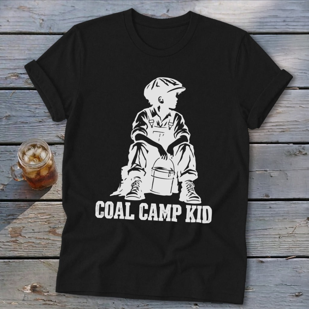 Black t-shirt with white graphic of a boy in overalls and cap holding a bucket, text reads "COAL CAMP KID".