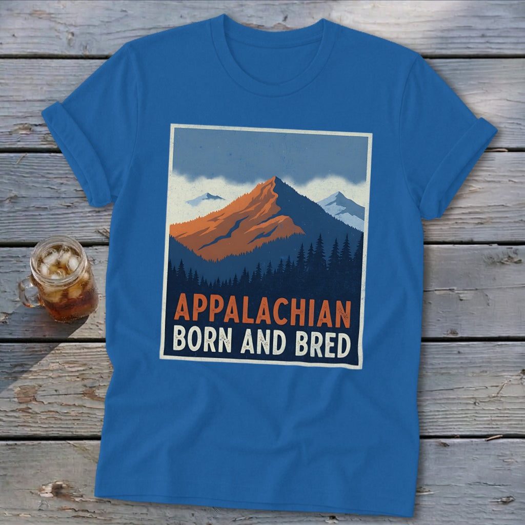 A blue t-shirt displaying a graphic of mountains and trees with the text Appalachian Born And Bred.