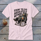 Light pink t-shirt featuring a cartoon bear relaxing in a rocking chair with text.
