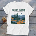 A white t-shirt features a graphic print of Dolly Sods Wilderness with pine trees and mountains.