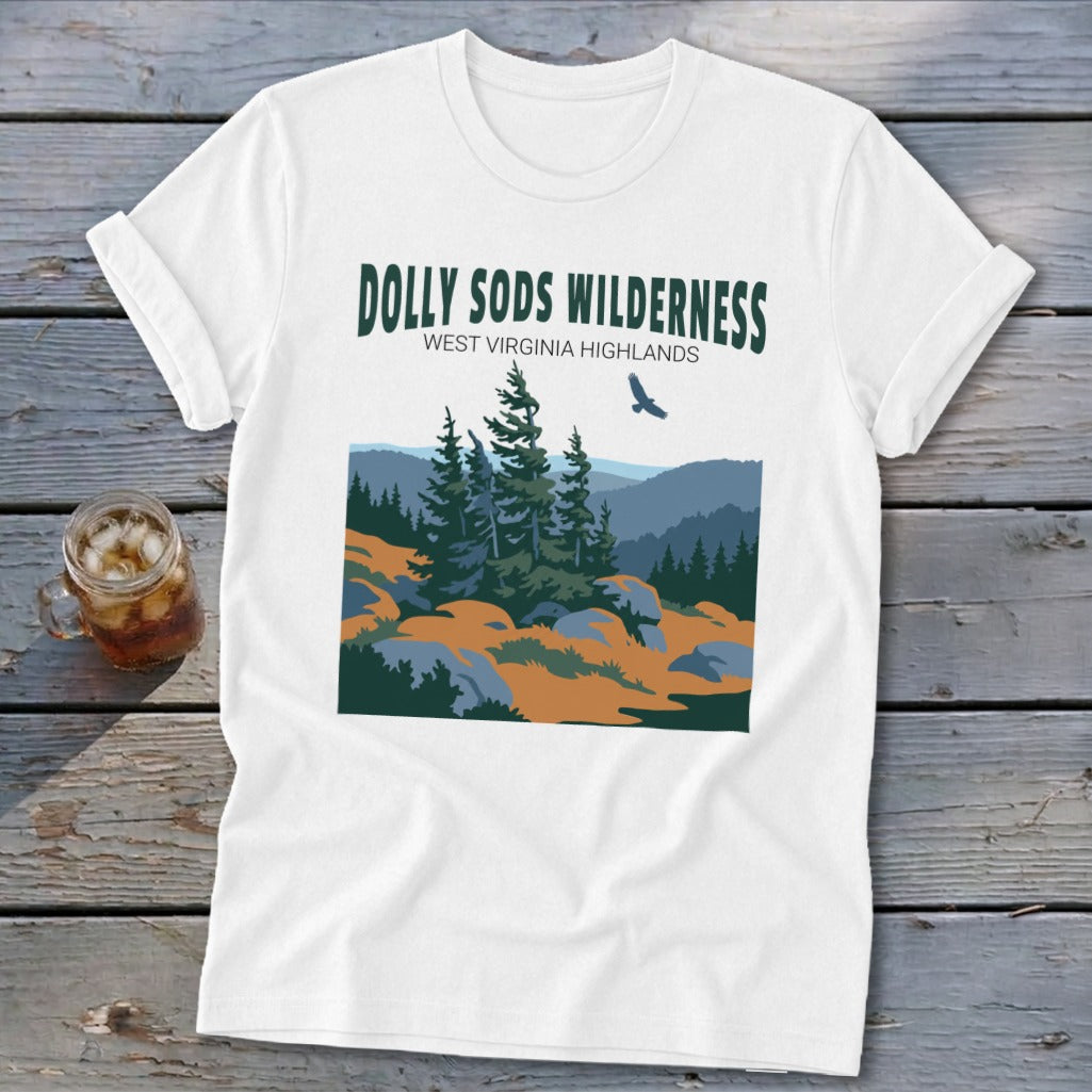 A white t-shirt features a graphic print of Dolly Sods Wilderness with pine trees and mountains.